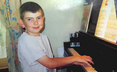 Brendan Tobin playing piano